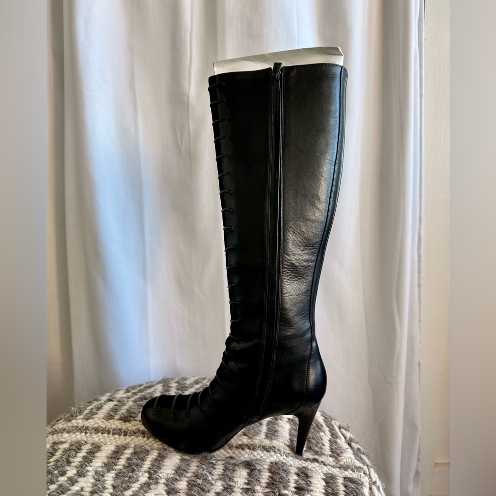 Cole Haan knee high Nike Air boots. 
Black Leather/Suede
4 Inch Heel.